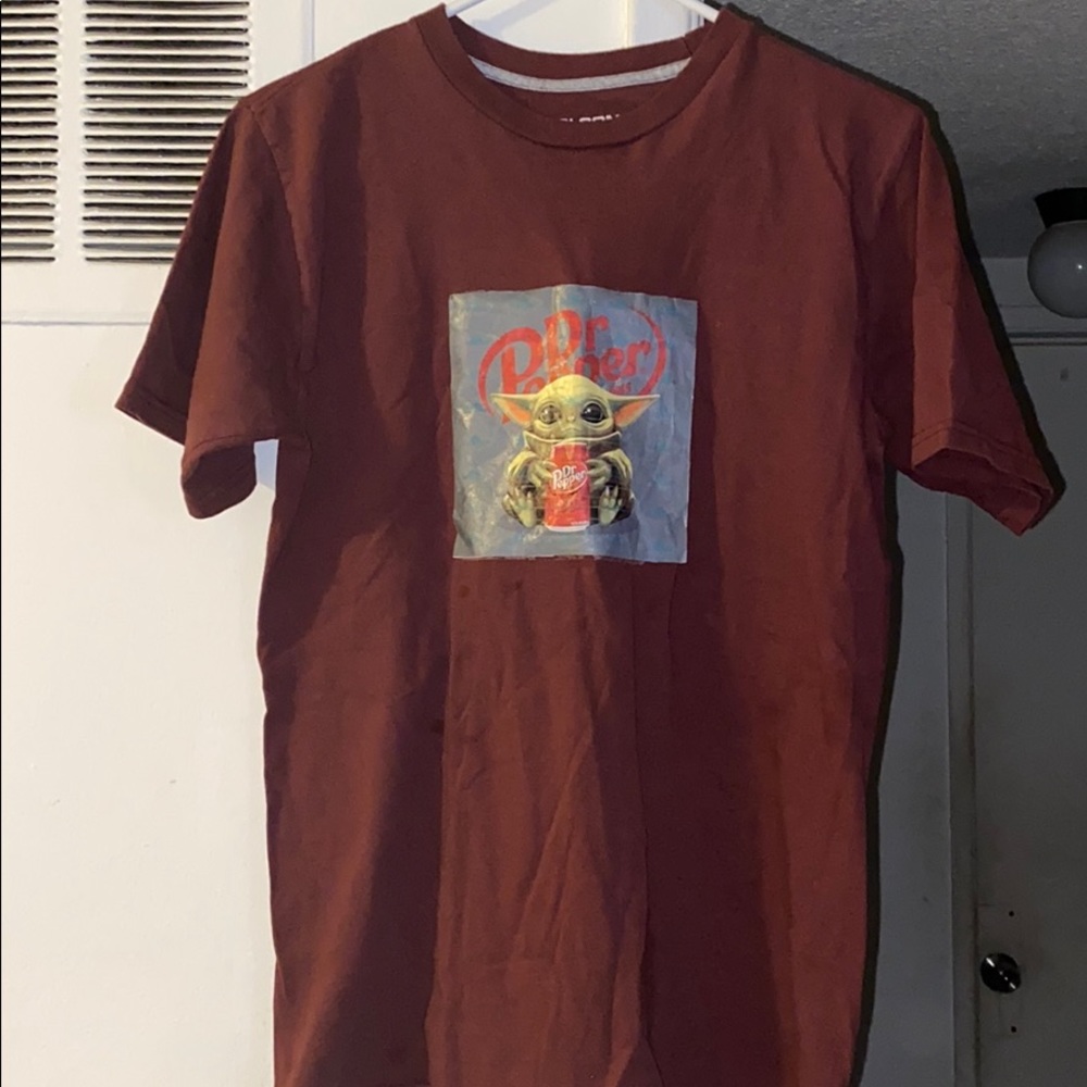 A Volcome T-shirt with a baby Yoda in the front